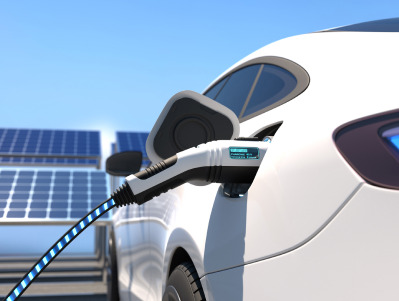 An electric car on charge depicting a sustainable investment.
